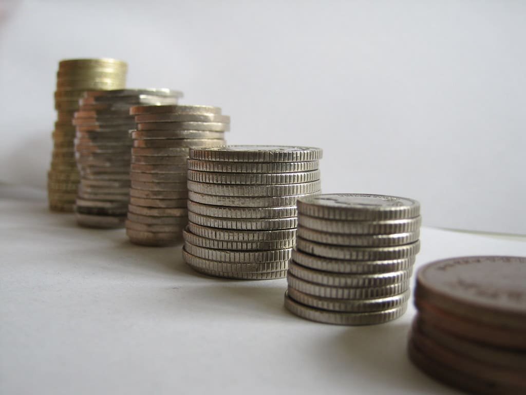 State pension age UK retirement savings coins stack