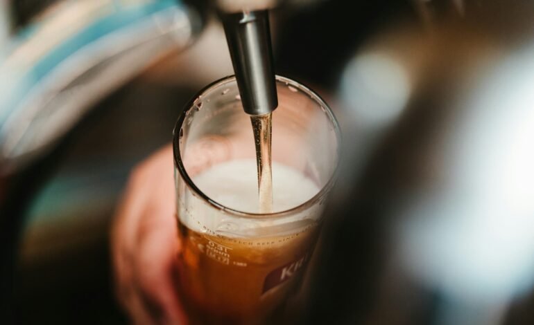 beer being poured into glass