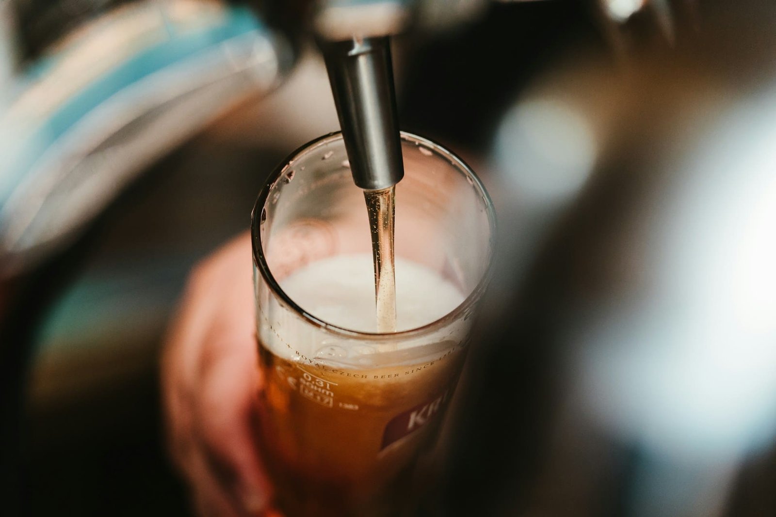 beer being poured into glass
