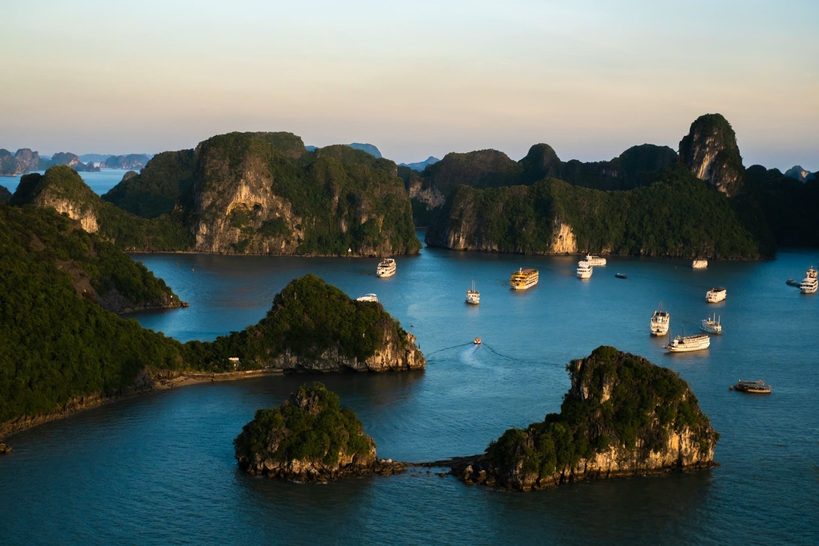 boats and islands in a bay in vietnam