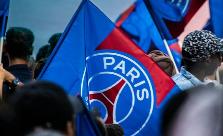 fans waving psg flags