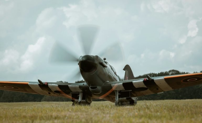 spitfire taxiing on a field