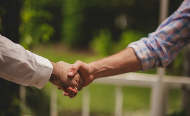 two people shaking hands
