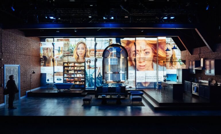 Interview review Riverside Studios – tech led set with social media projections across brick walls in a Brooklyn loft apartment design