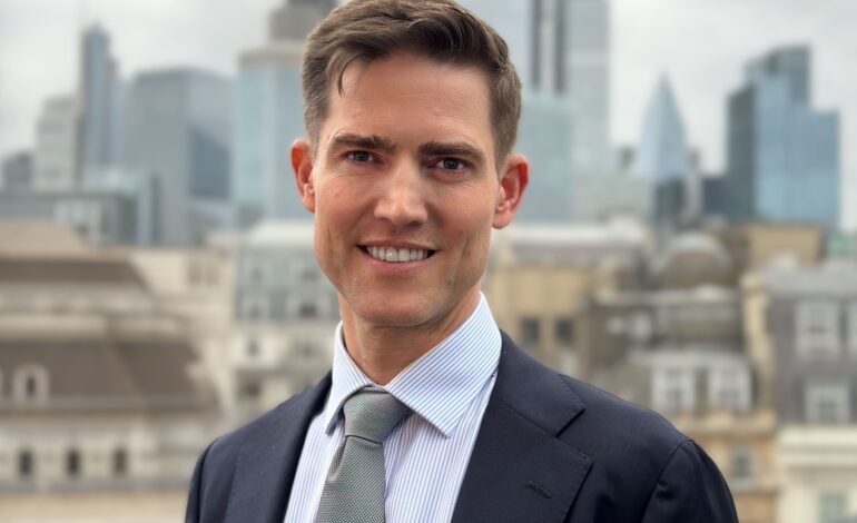 Tom Sleigh, Chair of Planning & Transportation, in the City of London with the Square Mile skyline; City Plan 2040 interview