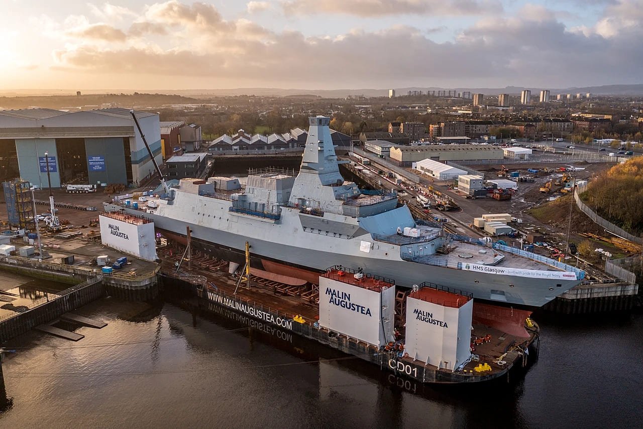 frigate being built at a shipyard