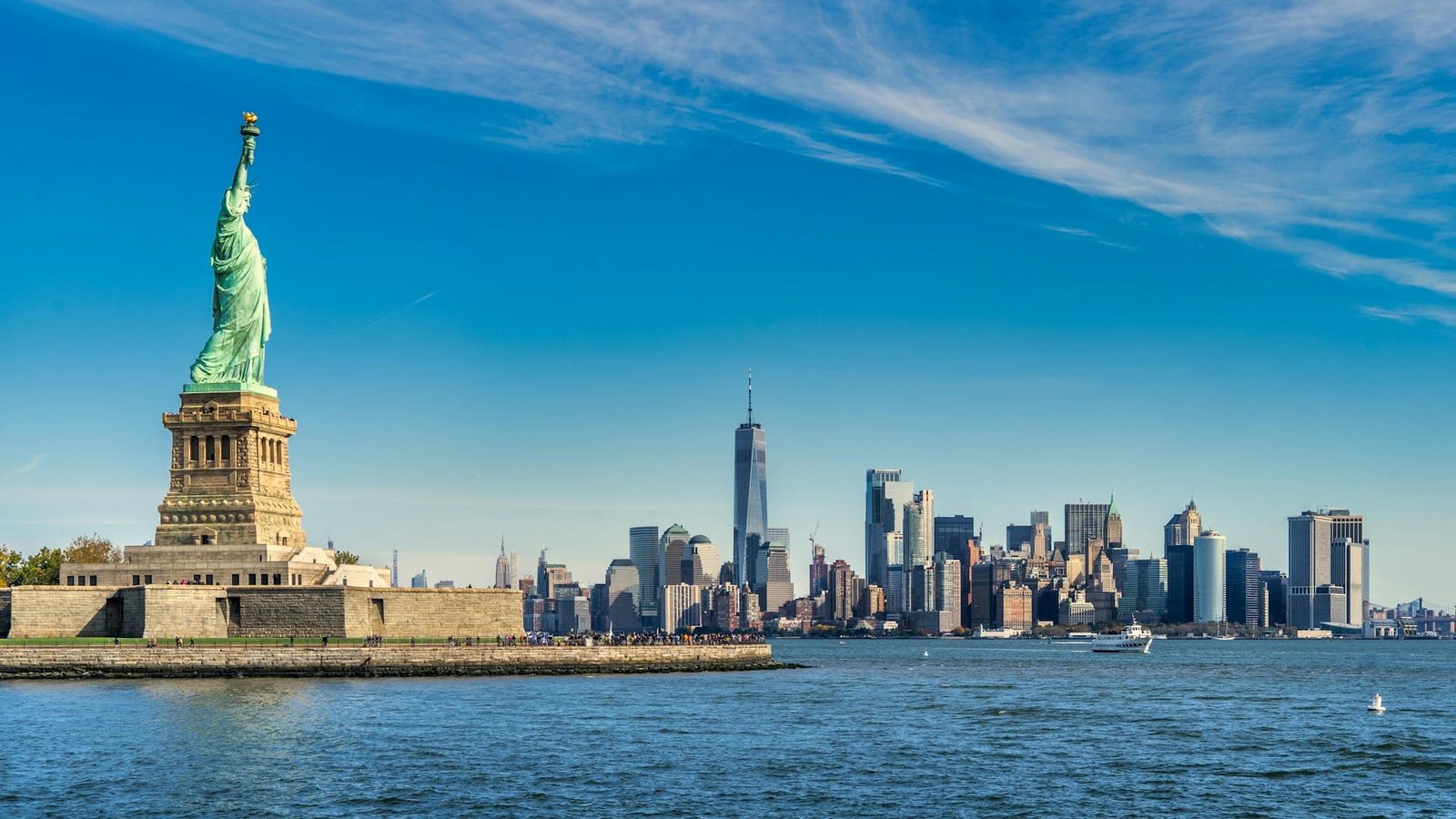 statue of liberty with new york behind