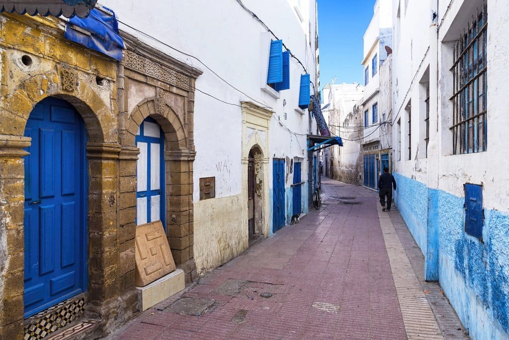 A quiet street in the medina of Essaouira — where whitewashed walls and striking blue doors reflect the city’s coastal heritage and distinctive architectural style.