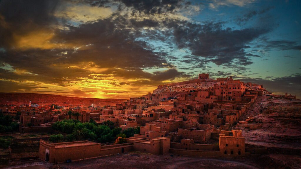 Ait Ben Haddou glowing at sunset — the ancient ksar’s terracotta walls and desert landscape reveal Morocco’s timeless desert heritage.
