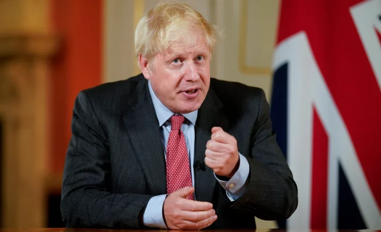 Boris Johnson faces Covid inquiry over impact of school closures on children, speaking beside a Union flag in London.