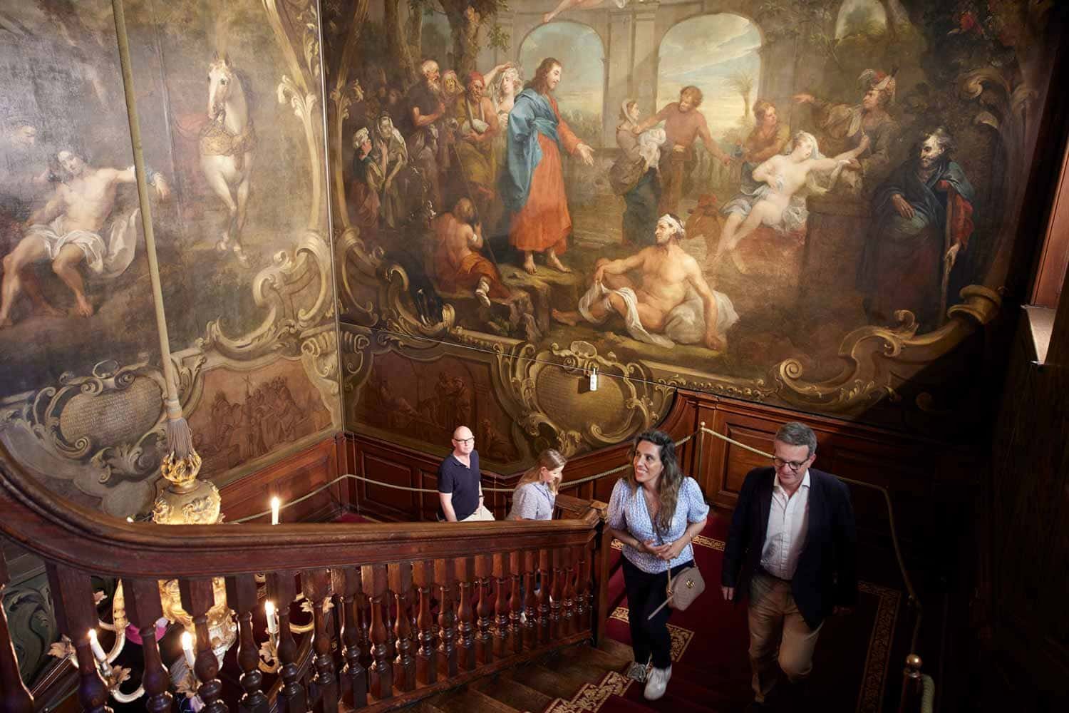 Hogarth murals St Bartholomew’s Hospital on the Hogarth Stair with visitors in the restored North Wing
