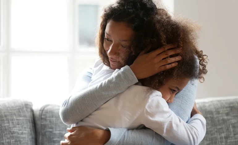 A mother comforting her child at home during Anti Bullying Week 2025 – Power for Good campaign.