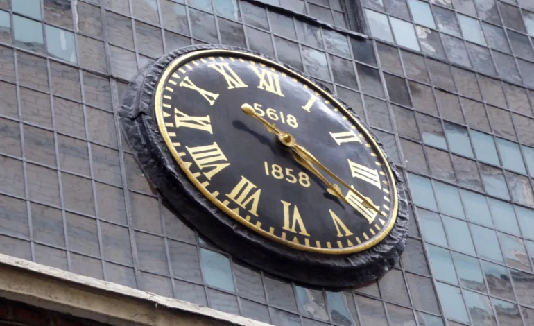 Clock outside Bevis Marks Synagogue during the Lady Mayor of the City of London honour