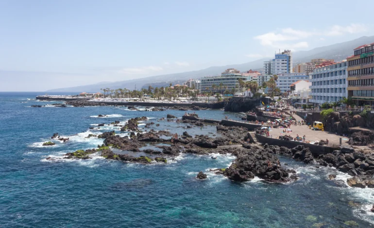 Tenerife’s calm broken by towering waves.