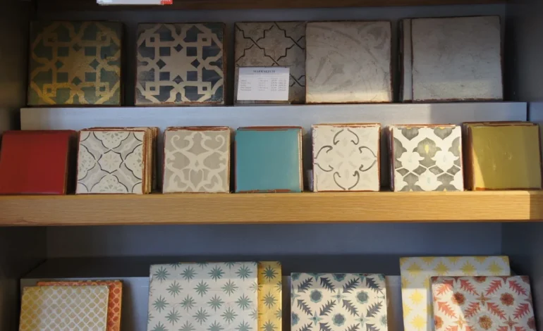 Fired Earth collapse shown through a display of patterned Fired Earth tiles in a UK showroom