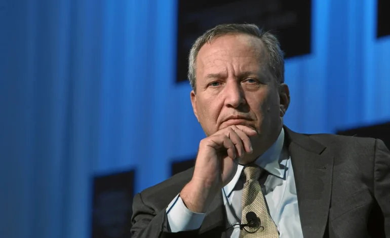Larry Summers on stage at a public event, pictured before stepping back from public life following Epstein email revelations.