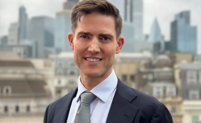 Tom Sleigh Chair of Planning Transportation in the City of London with the Square Mile skyline City Plan 2040 interview 770x470