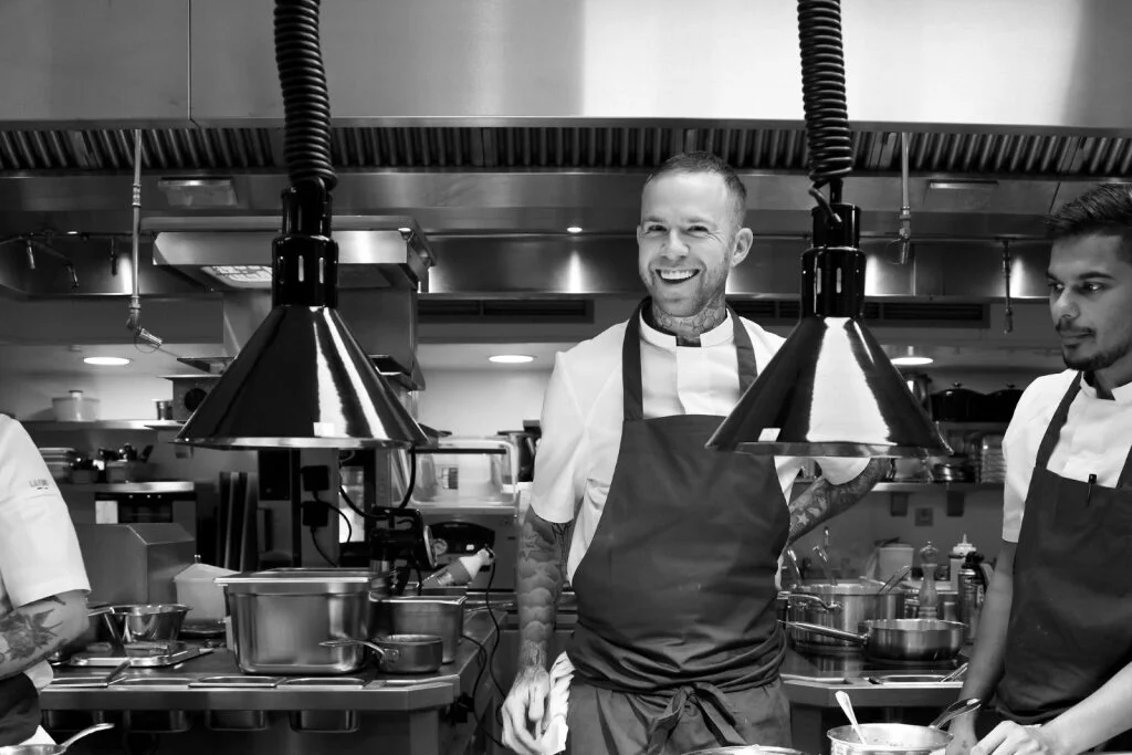 Chef Ben Murphy at work in the kitchen at 74 Charlotte Street, where precision and calm define the rhythm of service.