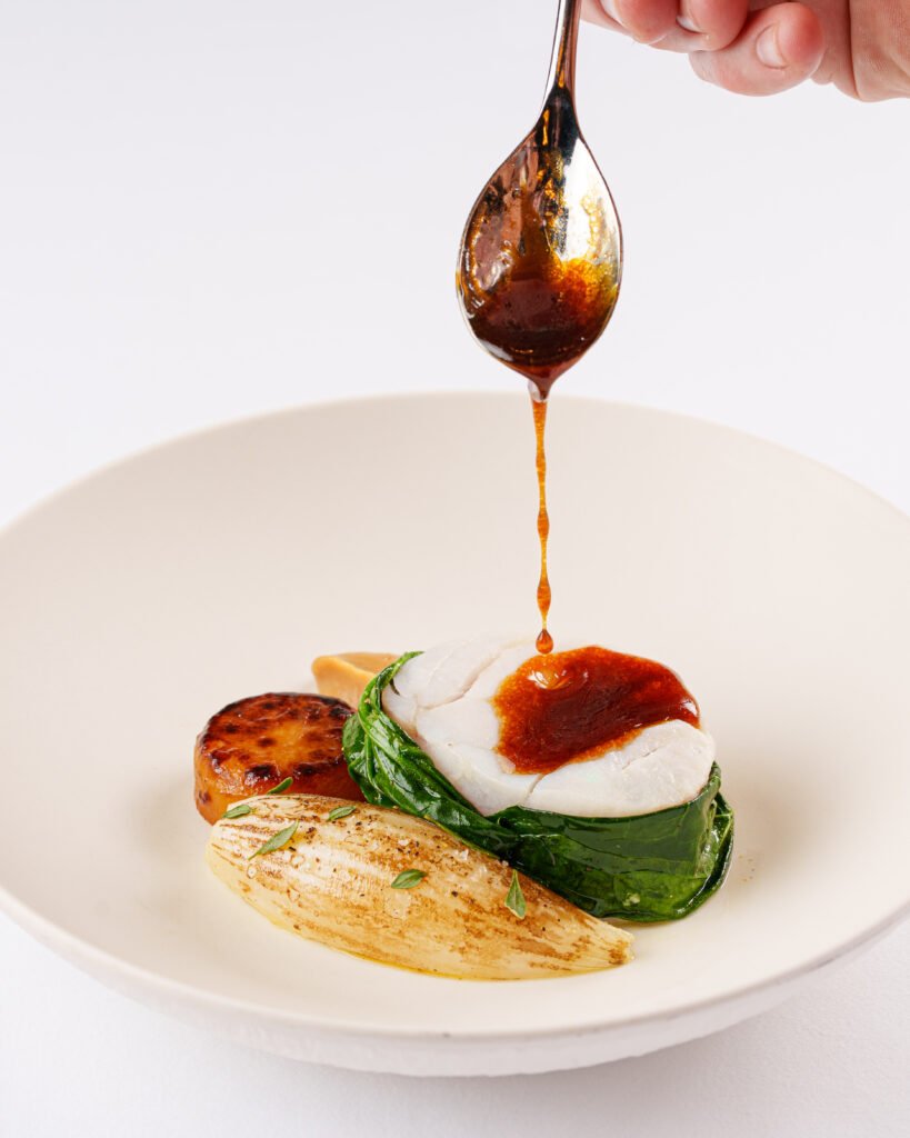 Cod with Roscoff onion and chicken jus at Tom Brown at The Capital.