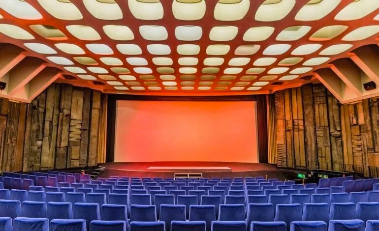 Interior of Curzon Mayfair art house cinema showing the original 1966 auditorium with sculptural wall reliefs and Victor Vasarely ceiling design