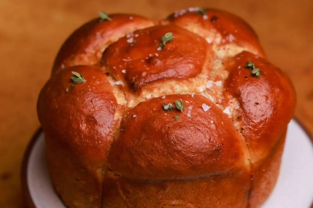 Milk bread with pumpkin seed hummus and noisette butter, served at the start of the tasting menu at 74 Charlotte Street.