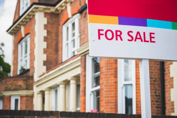 Mortgage rate cut impact shown by for sale sign outside London home