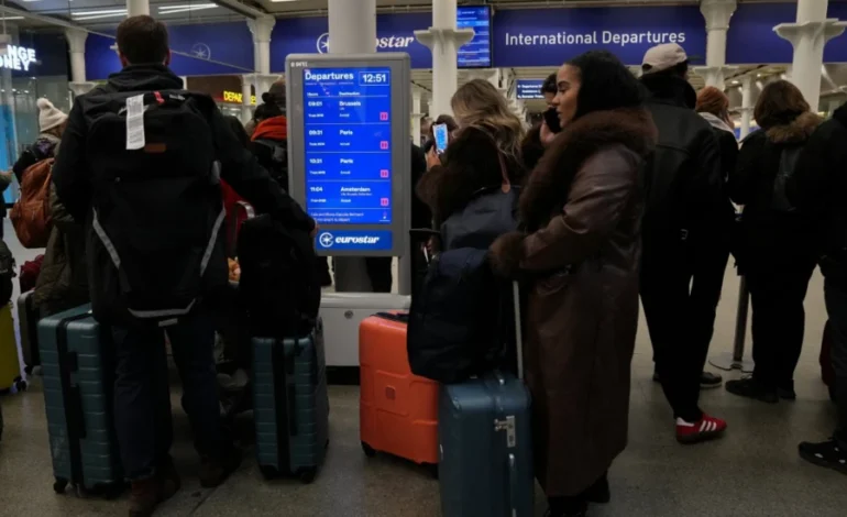 Passengers wait at London St Pancras International as a Channel Tunnel power outage causes Eurostar cancellations | Reuters