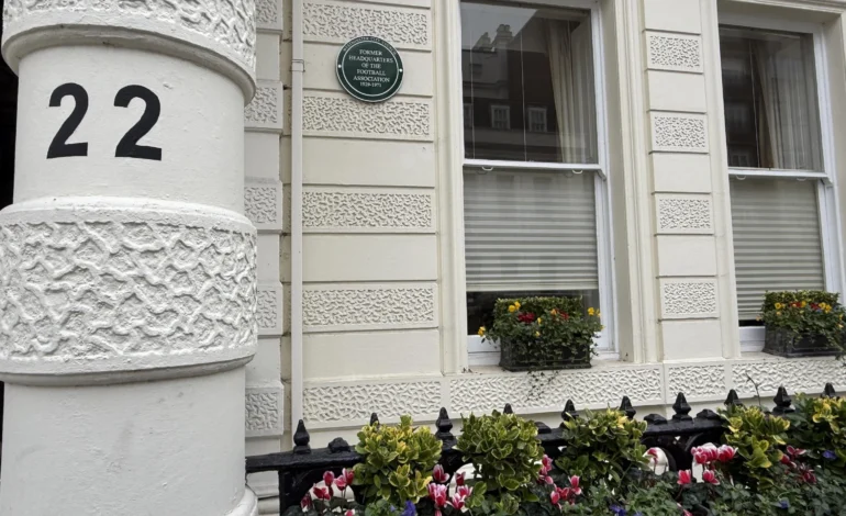 green plaque celebrating football heritage