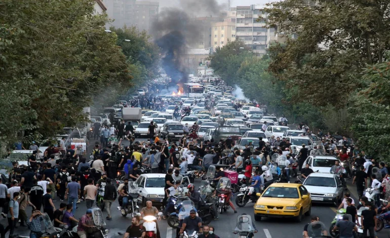 Crowds gather on a main road in Tehran as Iran protests continue into a third week