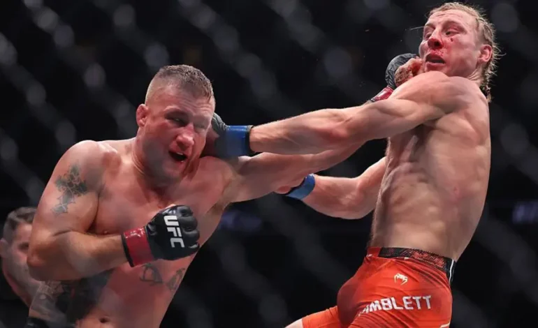Justin Gaethje lands a right hand on Paddy Pimblett during their UFC interim lightweight title fight in Las Vegas