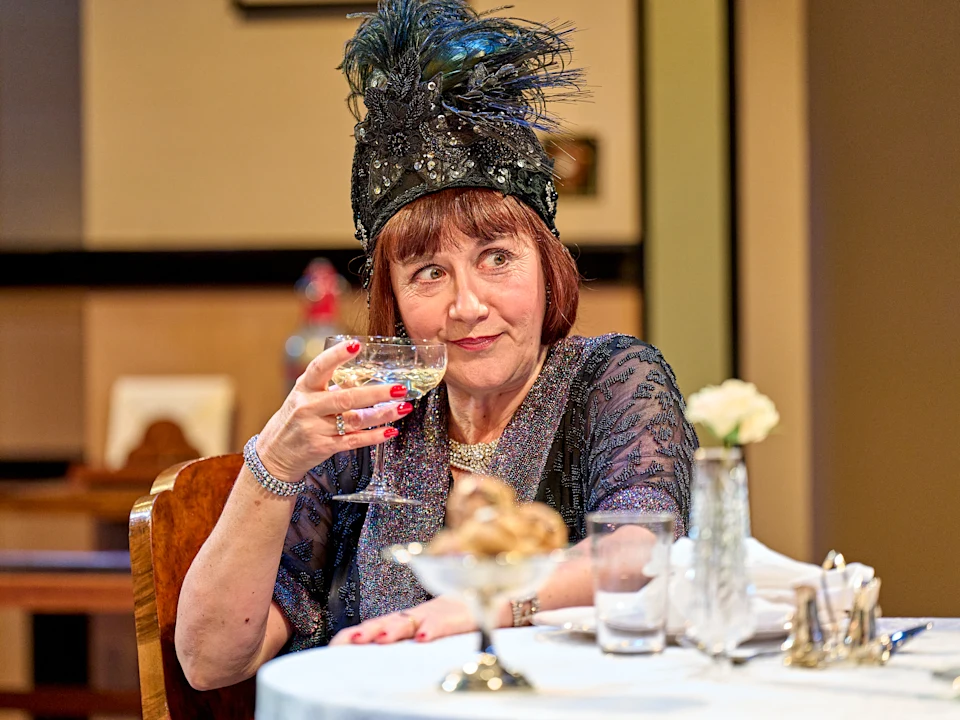 Alexandra Gilbreath as Jane Banbury in Fallen Angels at the Menier Chocolate Factory, revelling in Coward’s wit and champagne soaked nostalgia.