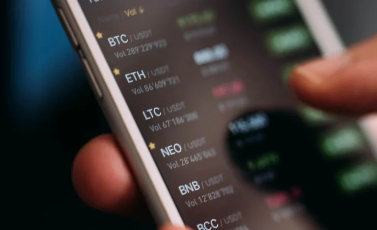 Mobile trading screen showing falling prices during a crypto liquidation surge