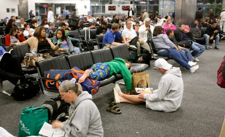 Passengers wait in long queues at a European airport amid Europe entry exit system delays