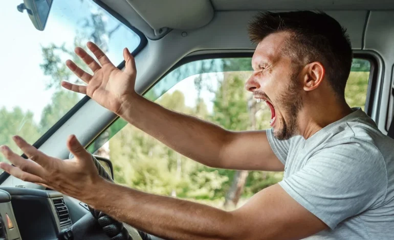 road rage angry man behind the wheel of a car