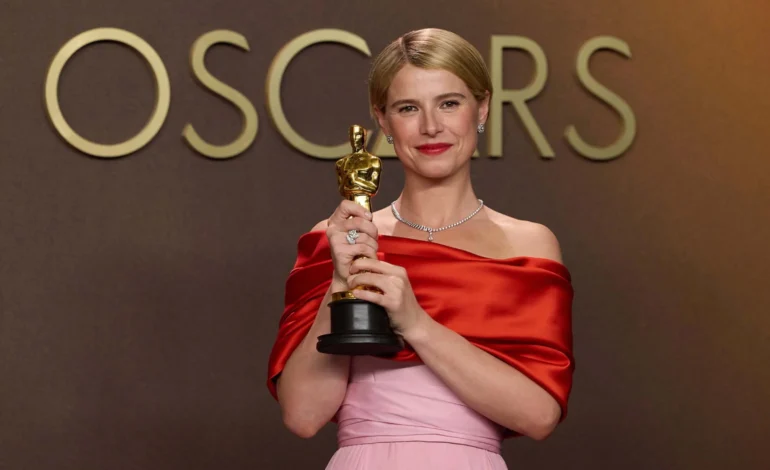 Jessie Buckley holding her Oscar after winning best actress at the Academy Awards