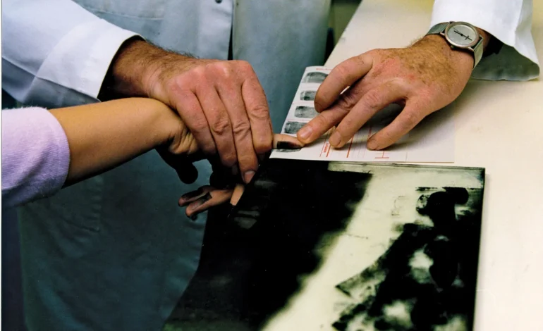 Metropolitan Police elimination database fingerprint sample being recorded for officer identification