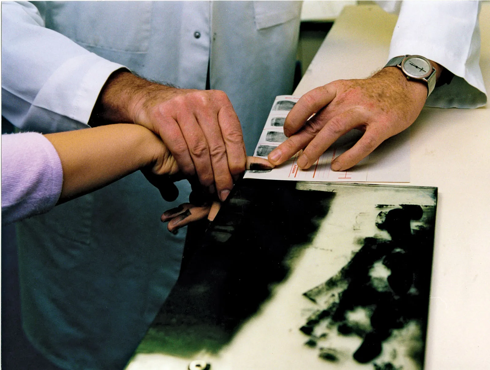 Metropolitan Police elimination database fingerprint sample being recorded for officer identification