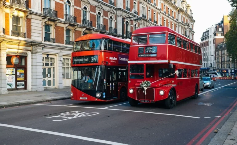 a boris bus next to an original routemaster