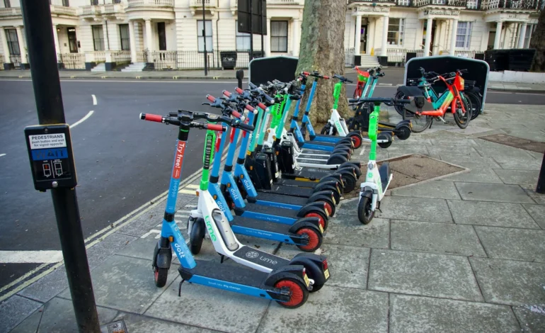 webp image of a bunch of e scooter trial bikes parked by the kerb