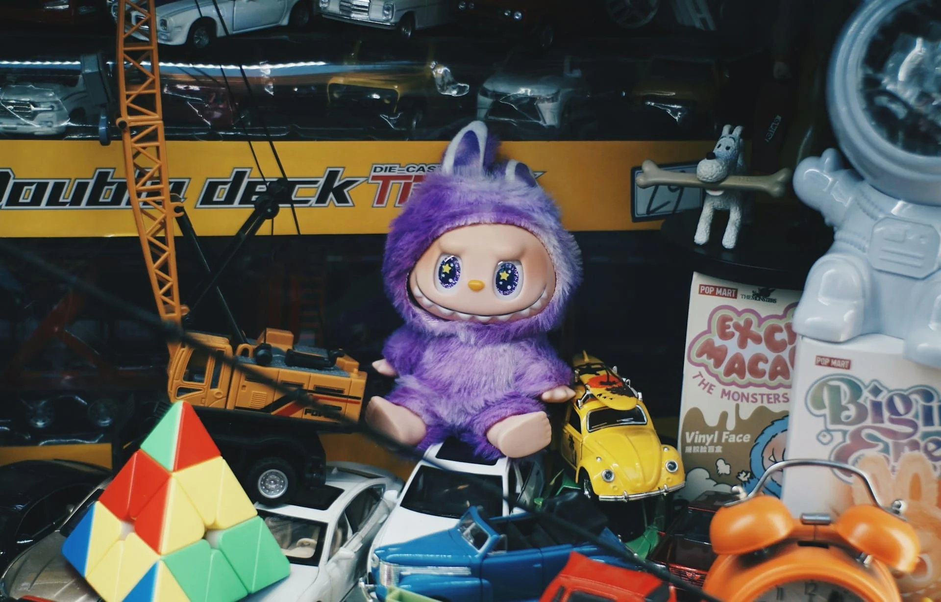 webp purple labubu surrounded by other toys