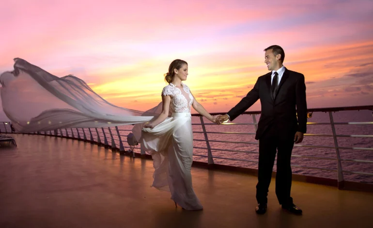 weddings at sea couple holding hands on cruise ship deck at sunset with flowing bridal veil