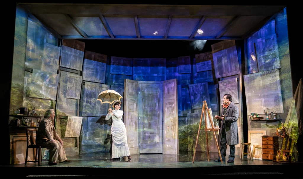 A moment of tension between Monet and Camille (Dean John Wilson and Brooke Bazarian), observed by the older artist (Jeff Shankley), in A Mirrored Monet at Charing Cross Theatre.