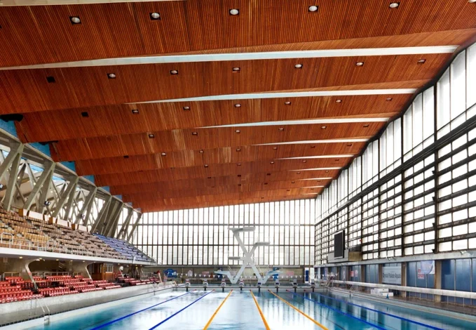 Crystal Palace sports centre redevelopment showing interior swimming pool and restored modernist architecture