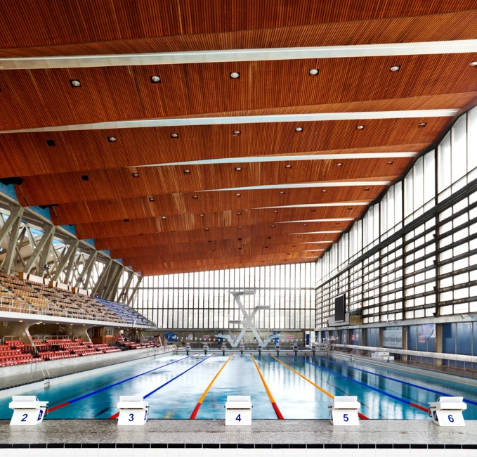 Crystal Palace sports centre redevelopment showing interior swimming pool and restored modernist architecture
