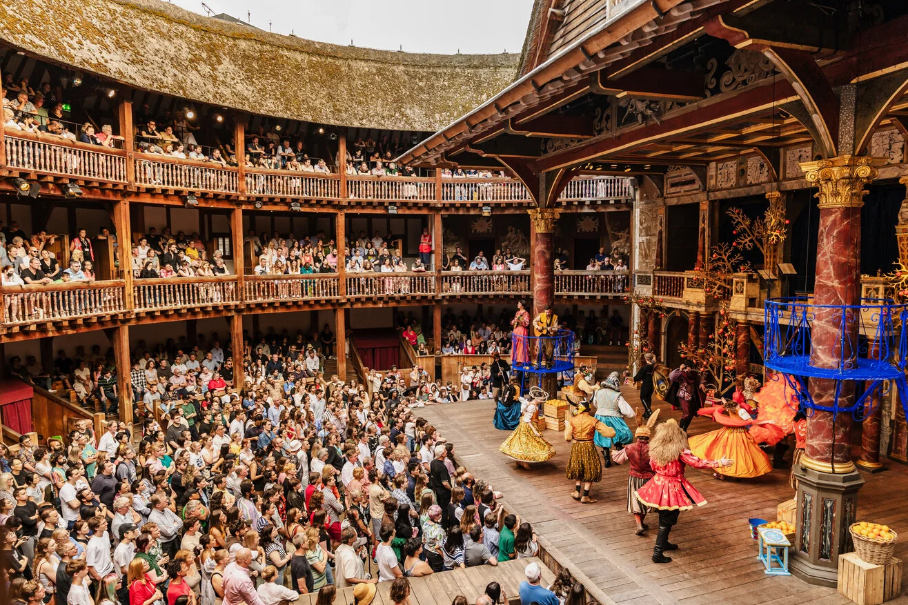 Shakespeare’s Globe open air theatre UK performance audience watching Much Ado About Nothing London. Farelight Production
