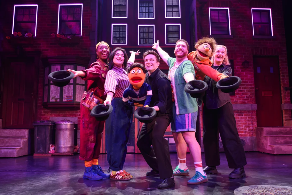 Cast members of Avenue Q on stage at the Shaftesbury Theatre, London. Image Credit Matt Crockett