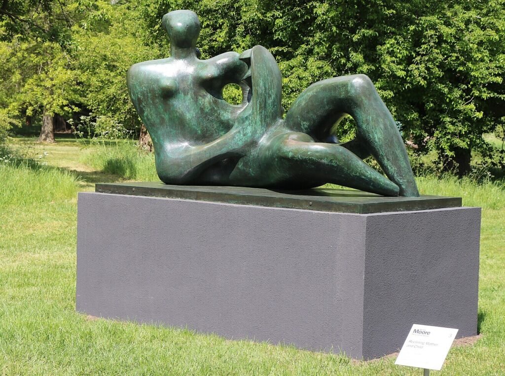 Henry Moore’s Reclining Mother and Child displayed in the open landscape of Kew Gardens.