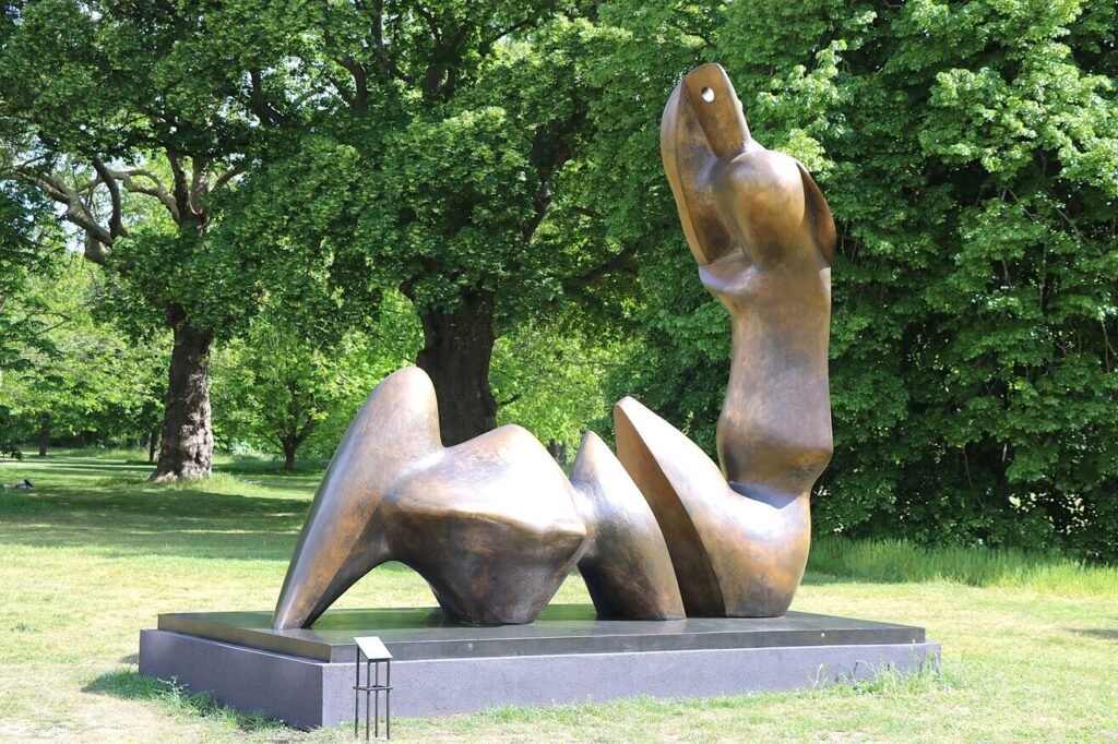 Henry Moore’s Two Piece Reclining Figure Cut on display in the gardens during the Henry Moore at Kew Gardens exhibition
