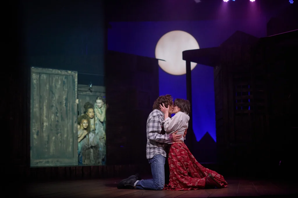A stolen kiss beneath the moon. [Image Credit | Tom Bowles]