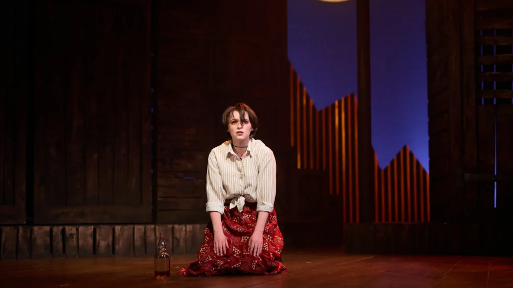 Barbara Allen, alone, before the town's prejudice closes in. [Image Credit | Tom Bowles]